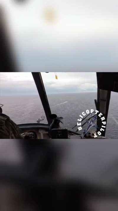 Russian Mi-8 attempting to destroy a Ukrainian naval drone.