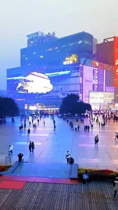 Huge wrap around video screen on side of building in Chongqing, China