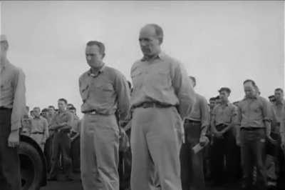 A rear gunner who was killed by japanese anti-aircraft fire during a raid on Manila Bay, Philippines is given a burial at sea while still strapped in his TBF Avenger torpedo bomber on USS Essex in November 1944 [video]