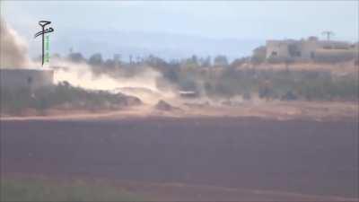 Opposition BGM-71 TOW team successfully targets an SAA tank at Zallaqiyat Checkpoint, Hama - 9/22/2014