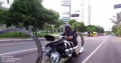 Hubless motorcycle with an airplane engine built by retired F1 driver.