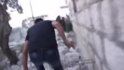 Opposition fighters attempt to shoot down/steal 55-gallon drums modified to drop supplies to besieged SAA soldiers in Jisr al-Shugur Hospital - 5/21/2015