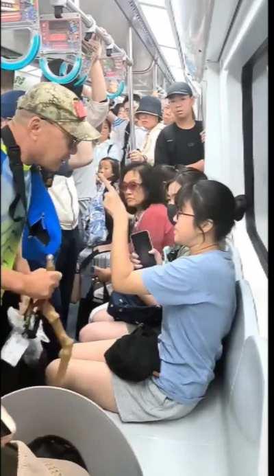 Elderly man on a subway in northern China forcibly demanding a seat from a girl.