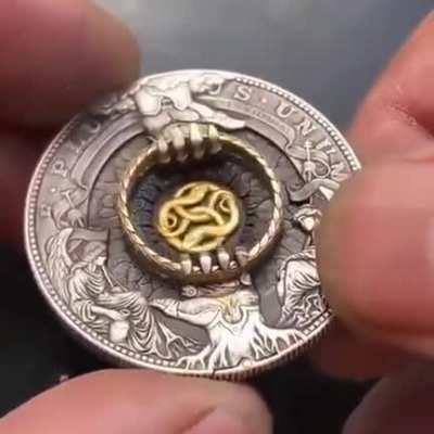 A coin that holds a ring.