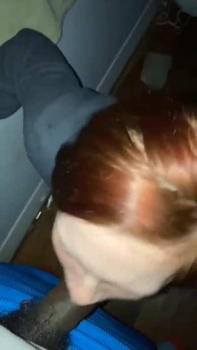 Cute redhead blows a dick