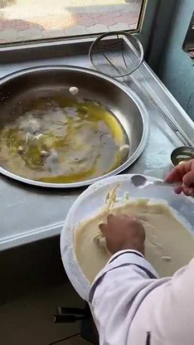 I din't know what he's making but it looks delicious and I want some.