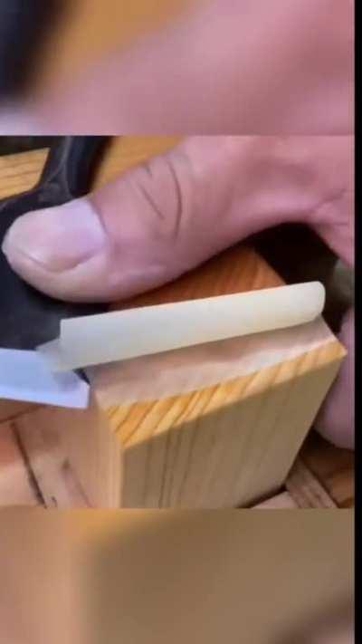 Chisel shaving wood