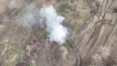 A Russian drone, drops a grenade into an abandoned Ukrainian M113 APC. Location unknown - October 2024