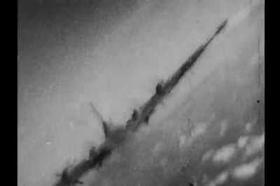 [WWII] 447th Bomb Group Boeing B-17 Flying Fortress raked with heavy cannon fire at close range by a Luftwaffe fighter