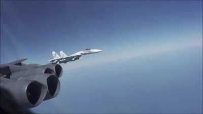 Russian Su-27 flying very close to a US B-52 yesterday over the Black Sea