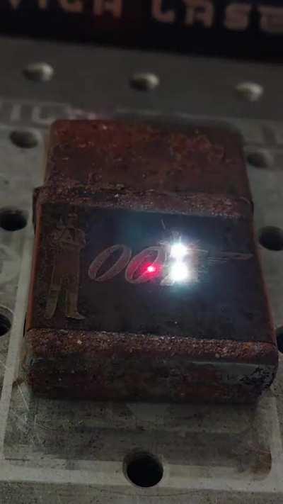 Laser engraving on a rusty lighter 