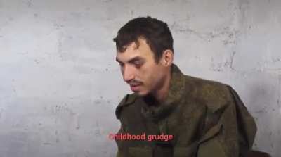 A russian POW being questioned by a Ukrainian rapper Yarmak.