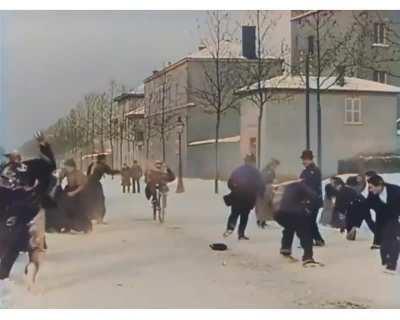 Snowball fight from 125 years ago (1897) in Lyon, France That has been colorized and speed adjusted.