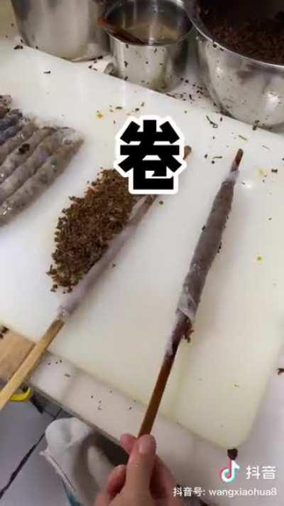 Making xiaojuanfen in Kunming, Yunnan. It's rolled up wood ear, minced meat, shiitake, scallion with some lemon and chili wrapped in rice milk skin