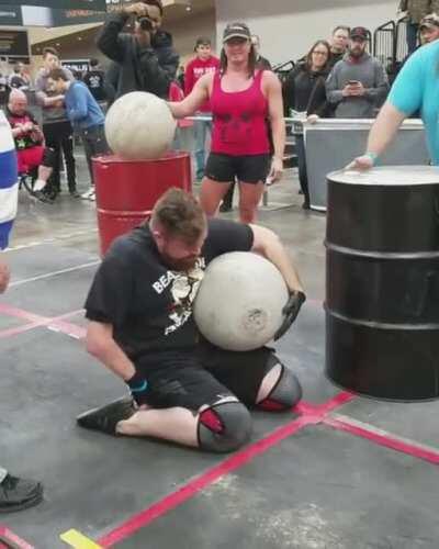 Handicapped man doing the Atlas Stones at Arnold Schwarzenegger’s Disabled Strongman competition