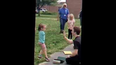 Guy tries to high five girl who doesn't have arms