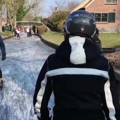 Ice skating on the canals of Giethoorn, Netherlands.