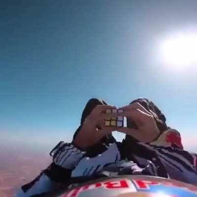 Jeff Provenzano solves a Rubik’s Cube while free falling