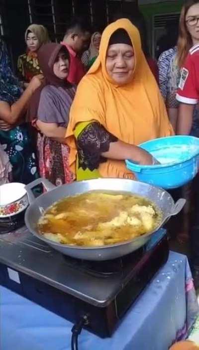 Stirring boiling oil with bare hands.