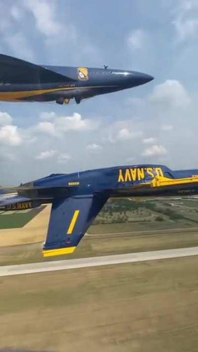 A double farvel which is an aerobatic maneuver of the Blue Angels flight demonstration squadron. It is a diamond formation with 2 of the 4 aircrafts inverted.