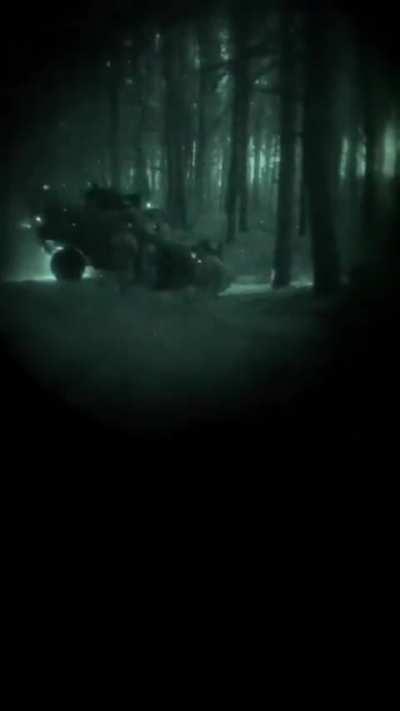 Ukrainian soldiers at night skirmishing with a Russian position somewhere in a forest in Luhansk Oblast (Unknown date)