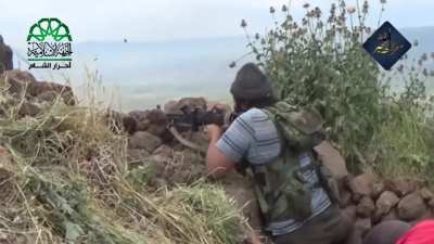 Ahrar al-Sham fighters use MGs & height to harass an SAA movement outside of Jisr al-Shughur, Idlib - 5/10/2015