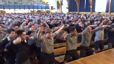 New Zealand school boys perform a blood chilling haka for their retiring teacher