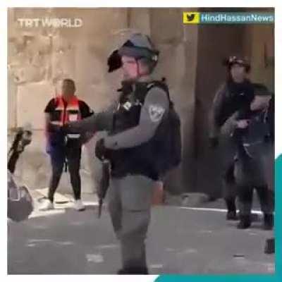 Israeli terrorist stops throwing grenade after noticing camera