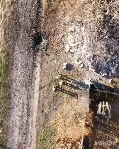 Russian soldiers set a Ukrainian home on fire. A drone operator spots them waiting and watching. Decides to drop a grenade on them