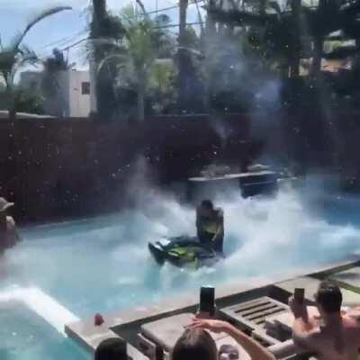 Jetski back flip in a small pool