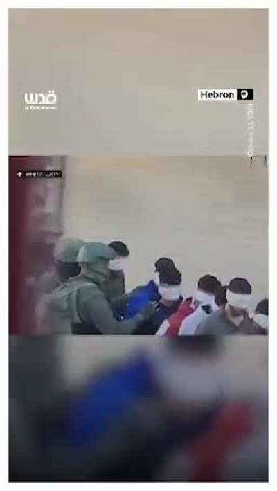 Israeli occupation forces assault a number of Palestinian youths before arresting and interrogating them during a military raid in the town of Dura, south of Al-Khalil, today.