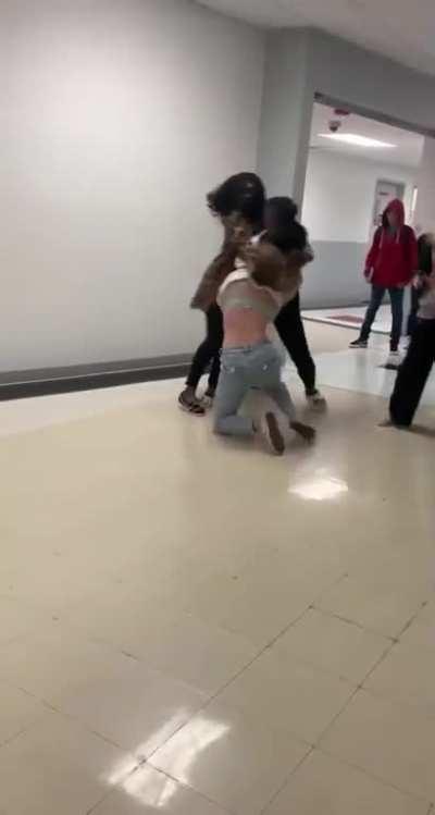 Hallway fight girl gets slinged around