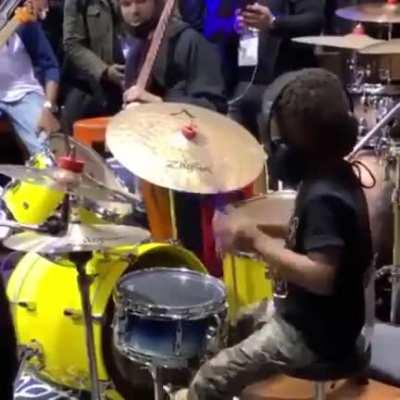 Young boy goes off on a drum solo