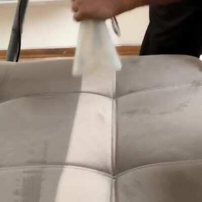 Steam cleaning a couch