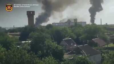 Ukrainian artillery strikes on a Russian logistics base in Polohy, Zaporizhzhia Oblast, Ukraine, June 2022. Includes Ukrainian drone POV as it is shot down with a surface-to-air missile.