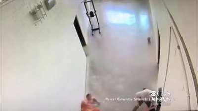 2 inmates decide to sneak attack a jail guard. A fellow guard sees what's happening and drops both inmates with his maglite