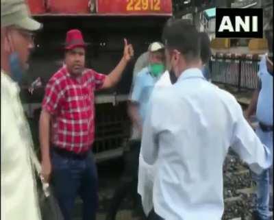 A man narrowly escaped death in Mumbai, India after the locomotive operator applied emergency brakes while the man was crossing the rail tracks