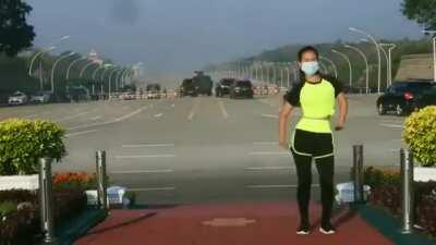 This woman was doing aerobics in Myanmar unaware of the military vehicles going behind her to overthrow the government in a coup