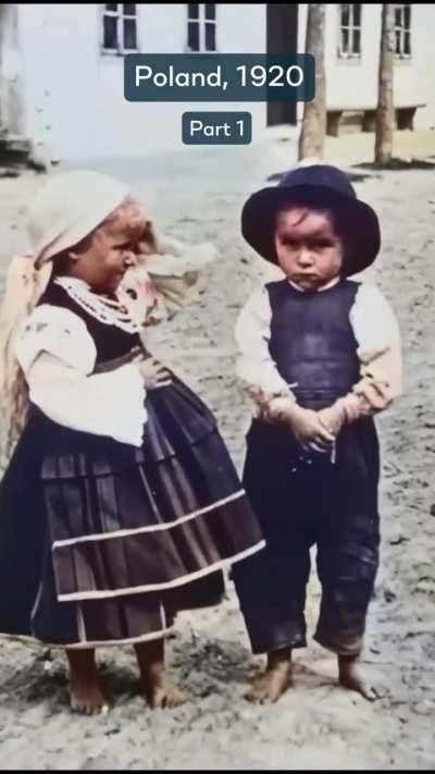 2 kids posing for the camera in Poland in 1920