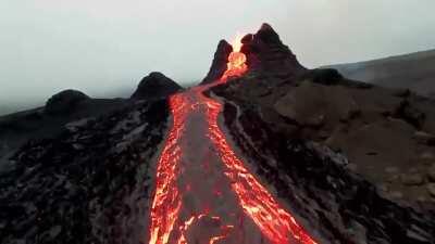 Drone footage at the volcanic eruption in Fagradalsfjall Iceland. (source in comments)