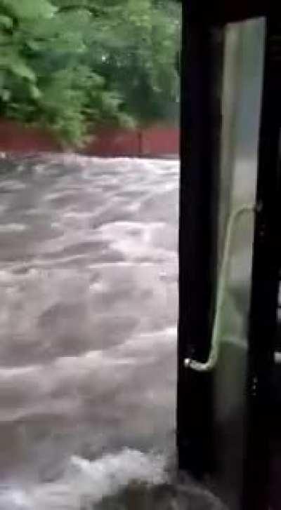 Bus driving through Delhi, India in street floods like it ain't no thang