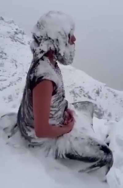 Yogi (monk) meditating in freezing temperatures (somewhere in Himalayas)