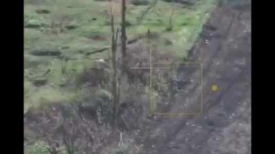 Ukrainian drone observes a Russian soldier who was hiding from a FPV drone which comes back around for him