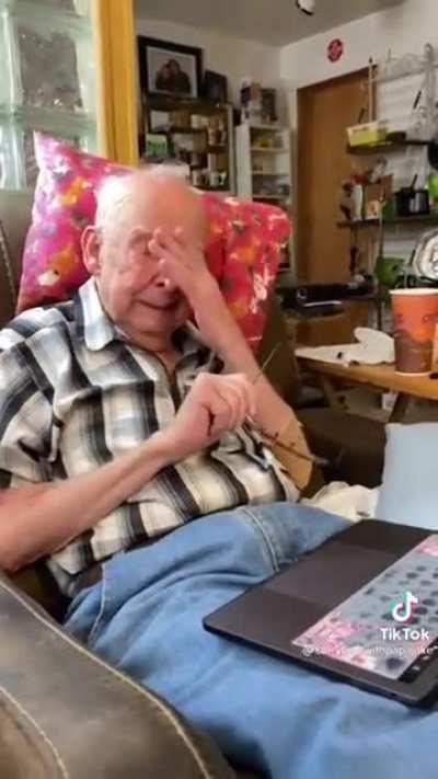 Grandpa's reaction to seeing her deceased wife in an animated photo