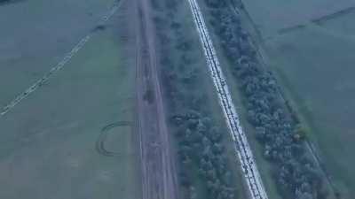 Drone view of Ukrainian 59th motorized infantry taking a trench then reportedly hitting Russian Chechen forces with artillery in Kherson Oblast (Music from source)