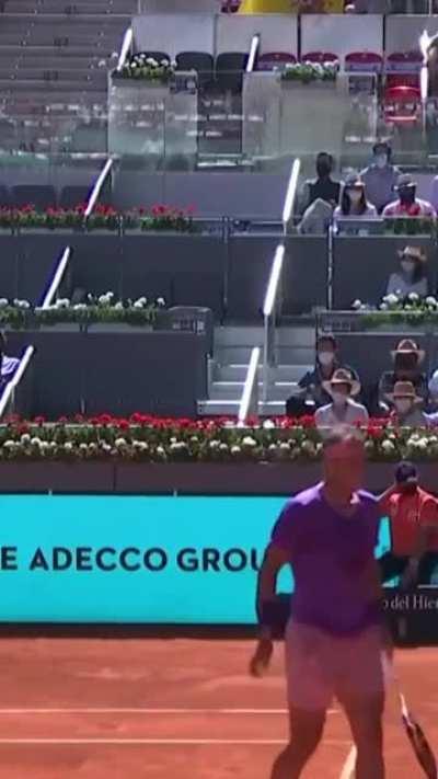 Rafael Nadal catches ball with racket