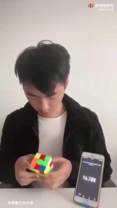 Man solves Rubik's cube , but in a different way