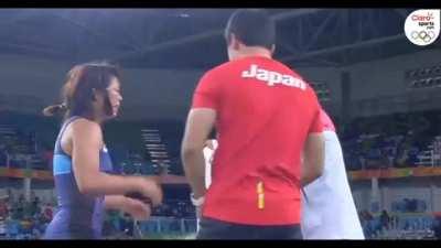 Risako Kawai flips and slams her wrestling coach after securing gold in the women's freestyle 63kg final.