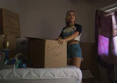 Brec wearing a crop top and jeans shorts in the Stargirl pilot