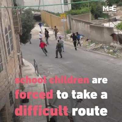 Palestinian school children fenced off from parents